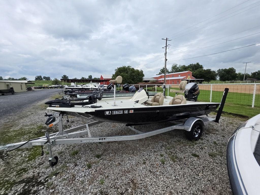 Xpress X17 Pro 2020 Xpress X17 Pro boat on trailer, parked outdoors under cloudy sky.