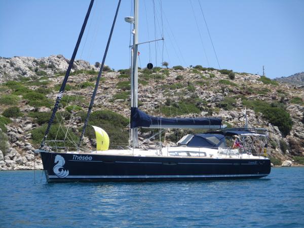 Beneteau Oceanis 50 Performance 2008 Beneteau Oceanis 50 Performance sailboat anchored near rocky coastline.