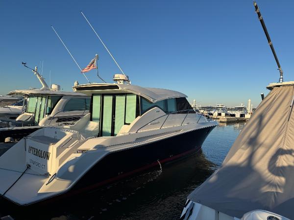 Tiara Yachts 39 Coupe 2016 Tiara Yachts 39 Coupe docked at marina under clear blue sky.