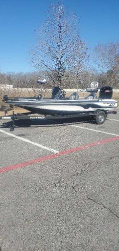 Nitro Z17 2025 Nitro Z17 boat parked in a lot on a sunny day.