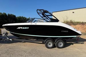 Yamaha Boats AR220 2026 Yamaha Boats AR220 on trailer, black and white design, parked outdoors.