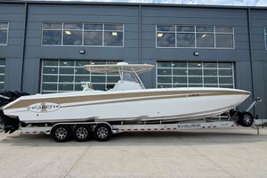 Cigarette 39 GT 2014 Cigarette 39 GTS boat on trailer, parked outside a modern building.