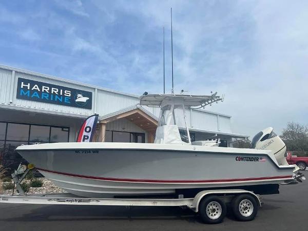 Contender 23 Open 2001 Contender 23 Open boat on trailer at Harris Marine dealership.
