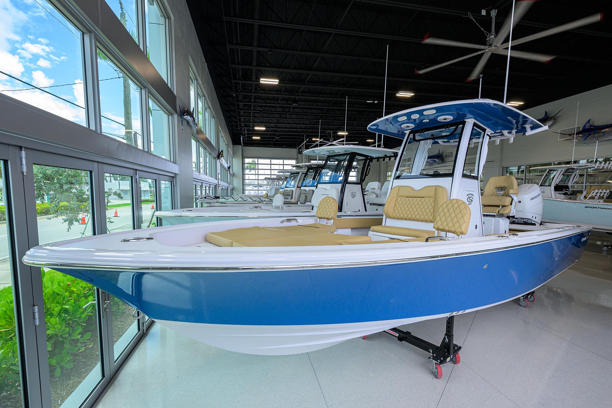 Sportsman Masters 267 Bay Boat 2025 Sportsman Masters 267 Bay Boat in showroom, featuring sleek blue design and modern amenities.