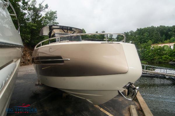 Invictus TT280S 2024 Invictus TT280S luxury boat docked near a serene lake.