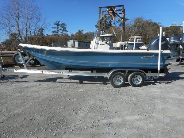 Bulls Bay 2000 2024 Bulls Bay 2000 boat on a trailer in a gravel lot.