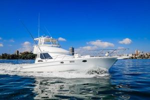 Precision 47 Flybridge 1993 Precision 47 Flybridge yacht cruising on clear blue water under a sunny sky.