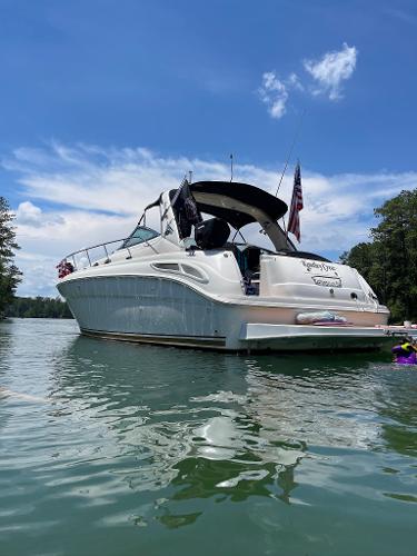 Sea Ray 380 Sundancer 2002 Sea Ray 380 Sundancer boat on calm water under blue sky.