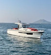 Nimbus T 11 2023 Nimbus T 11 boat on calm sea with mountain backdrop.