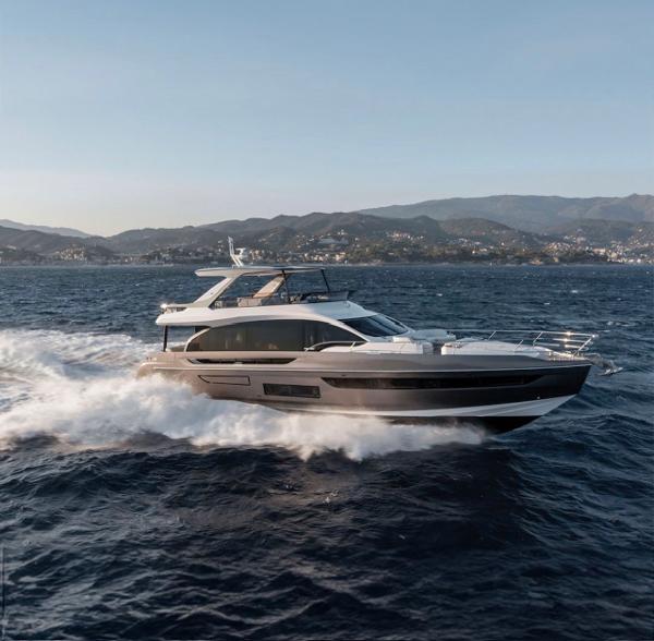Azimut NEW FLY 72 2025 Azimut NEW FLY 72 yacht cruising on open sea with scenic mountain backdrop.