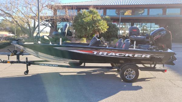 Tracker Pro Team 190 2025 Tracker Pro Team 190 boat on trailer, parked outdoors.