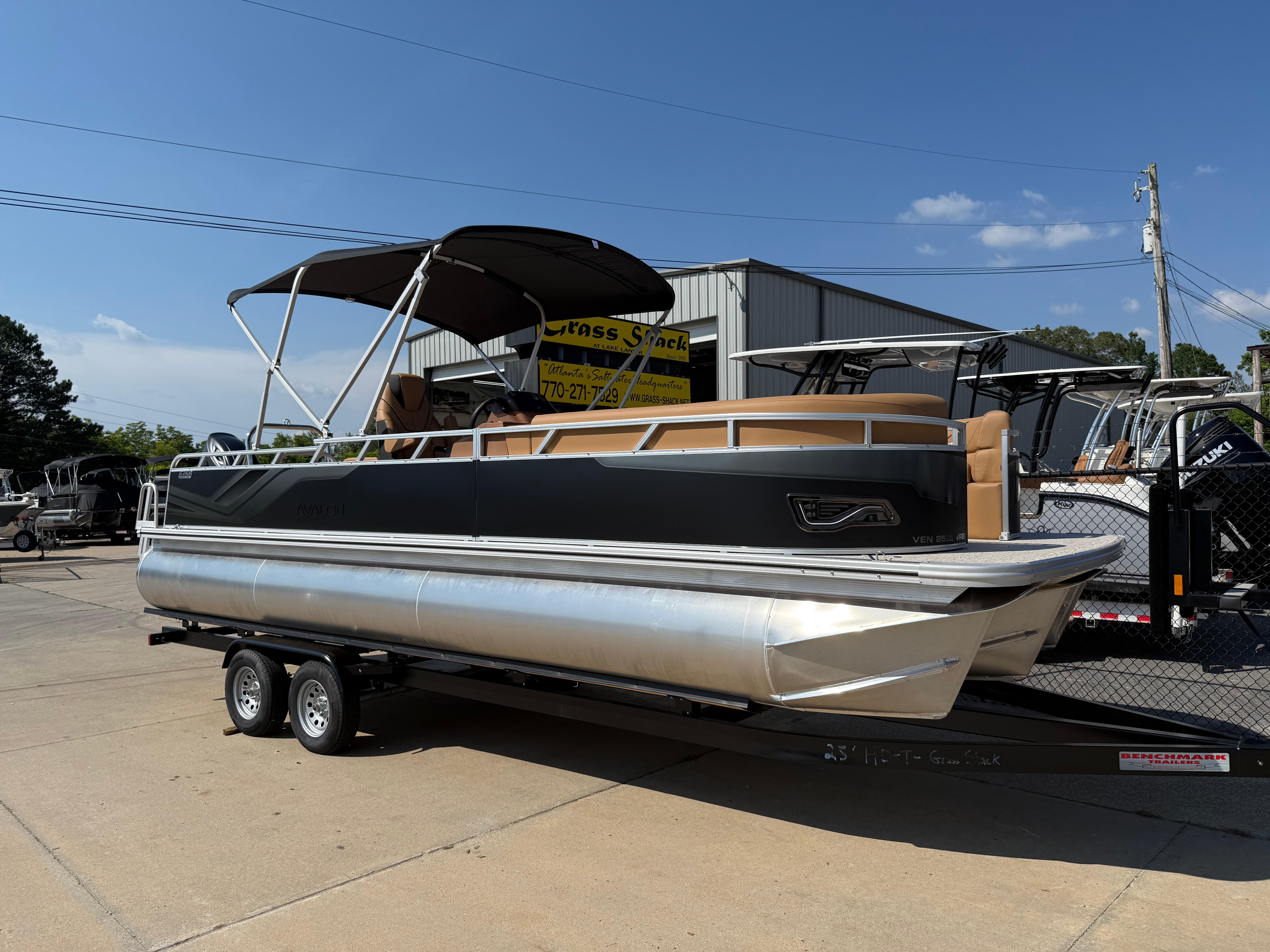 Avalon Venture 85 Versatile rear Bench 2025 Avalon Venture 85 Versatile Rear Bench pontoon boat on trailer, outdoor display.