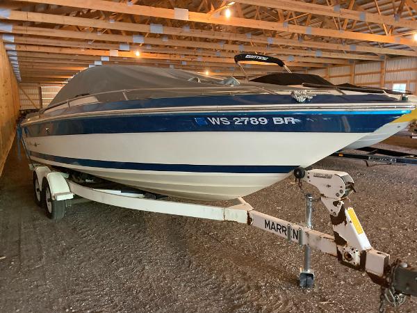 Sea Ray Sorrento 1987 Sea Ray Sorrento boat on a trailer in a storage facility.