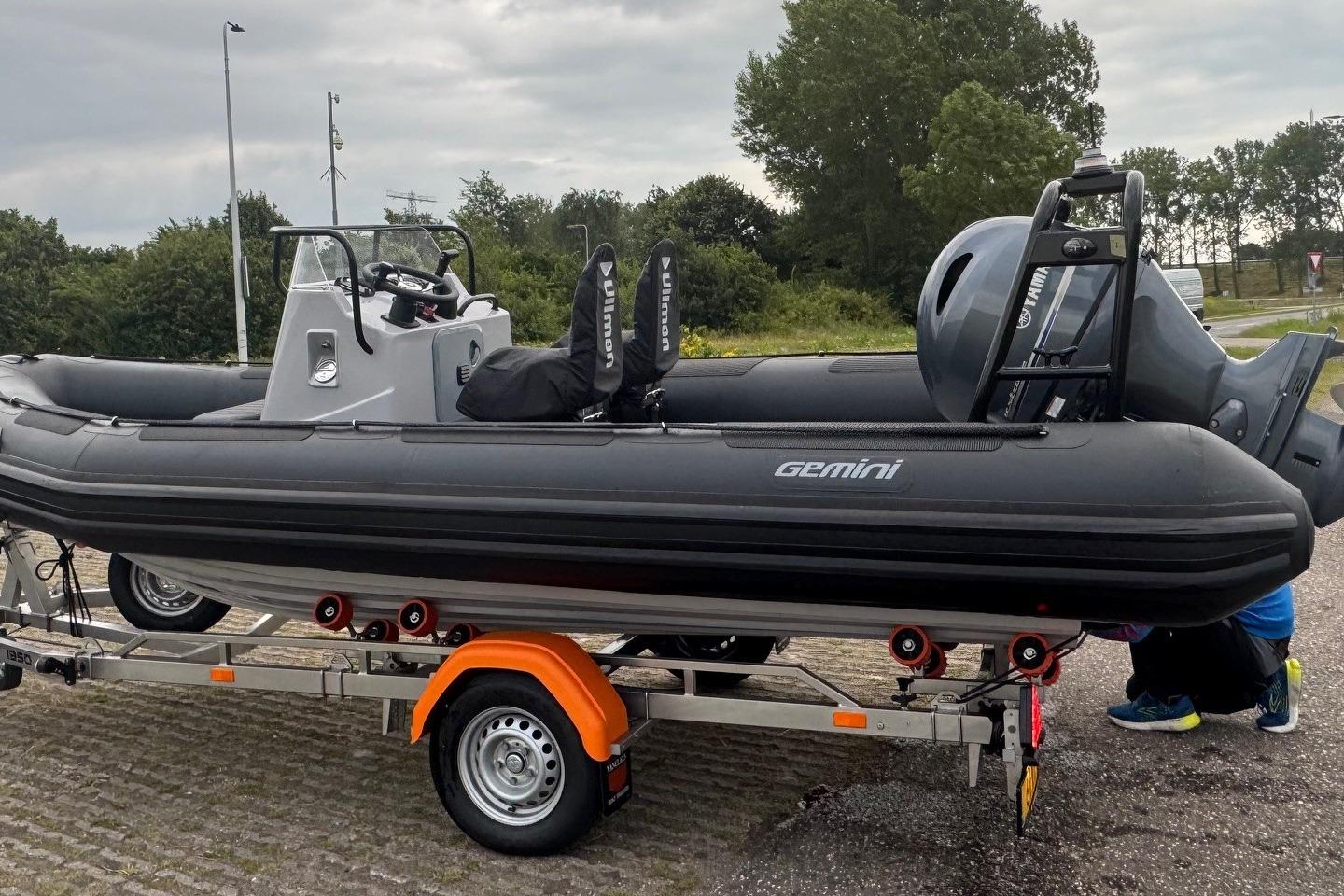 Gemini WR550 2025 Gemini WR550 inflatable boat on trailer, parked outdoors with overcast sky.