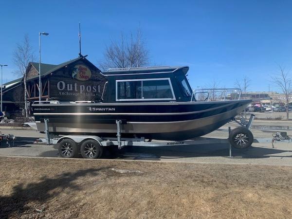 Spartan 240 Maximus Pro 2024 Spartan 240 Maximus Pro boat on trailer outside Bass Pro Shops Outpost.
