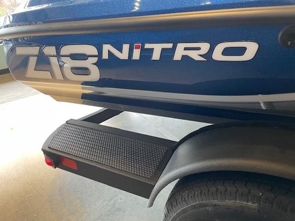 Nitro Z18 2025 Nitro Z18 boat trailer with step and logo detail.