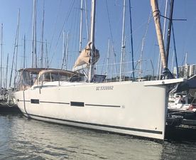 Dufour Grand Large 460 2016 Dufour Grand Large 460 sailboat docked in marina, clear sky background.