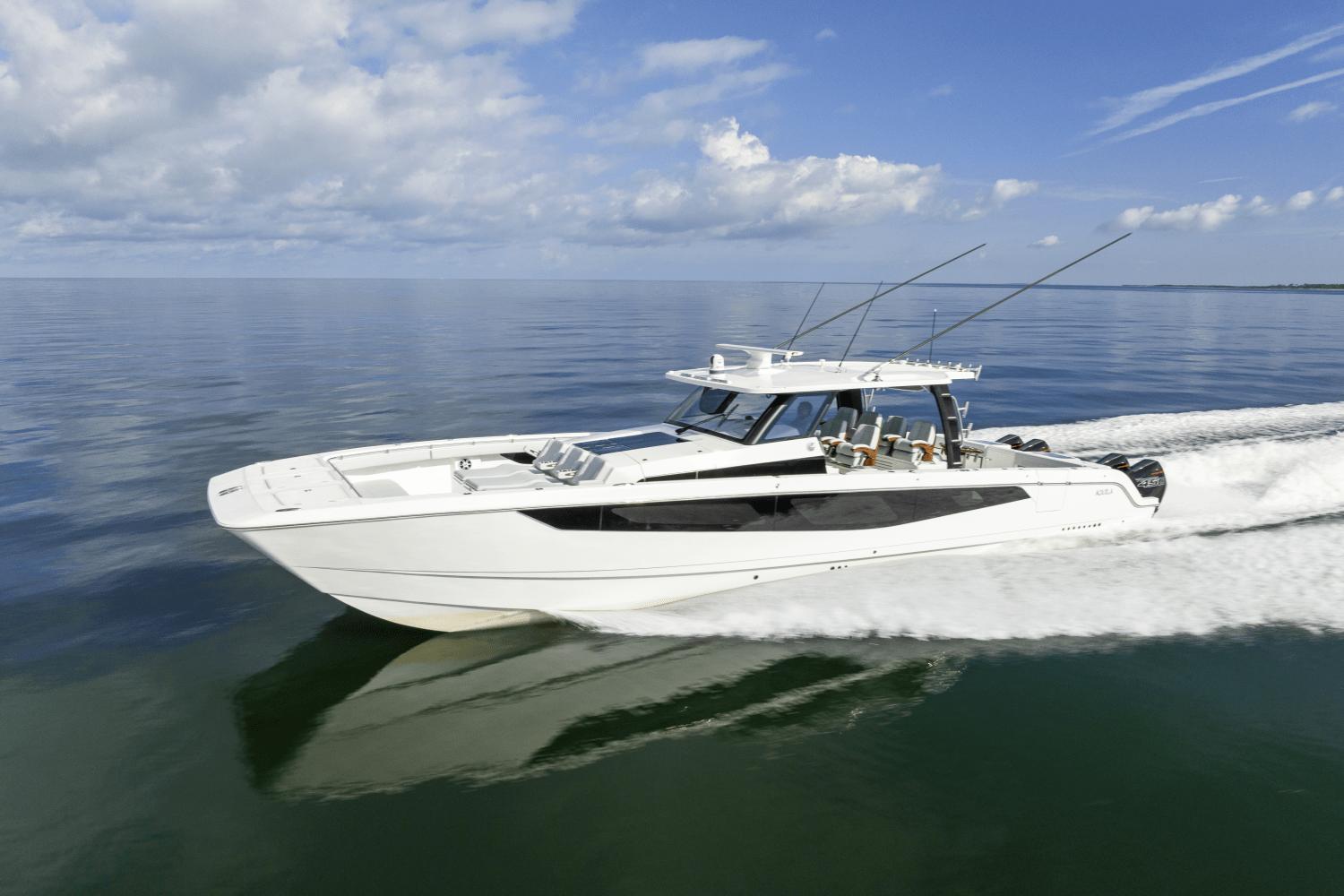 Aquila 47 Molokai 2024 Aquila 47 Molokai cruising on calm waters under a blue sky.