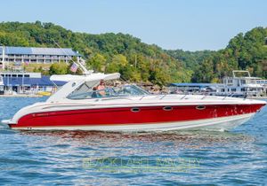 Formula 400 Super Sport 2003 Formula 400 Super Sport boat cruising on a scenic lake.