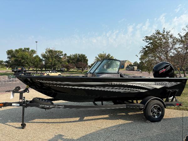 Ranger VS1782SC Angler 2024 Ranger VS1782SC Angler boat on trailer, parked outdoors.