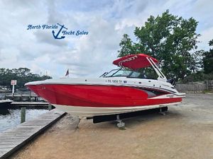 Monterey M-65 2023 Monterey M-65 boat in red, displayed at North Florida Yacht Sales.