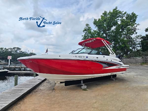 Monterey M-65 2023 Monterey M-65 boat in red, displayed at North Florida Yacht Sales.