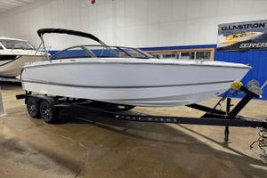 Four Winns H2 2026 Four Winns H2 boat on trailer in showroom.