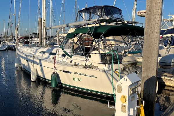 Beneteau 393 2005 Beneteau 393 sailboat docked in marina, sunny day, clear sky.