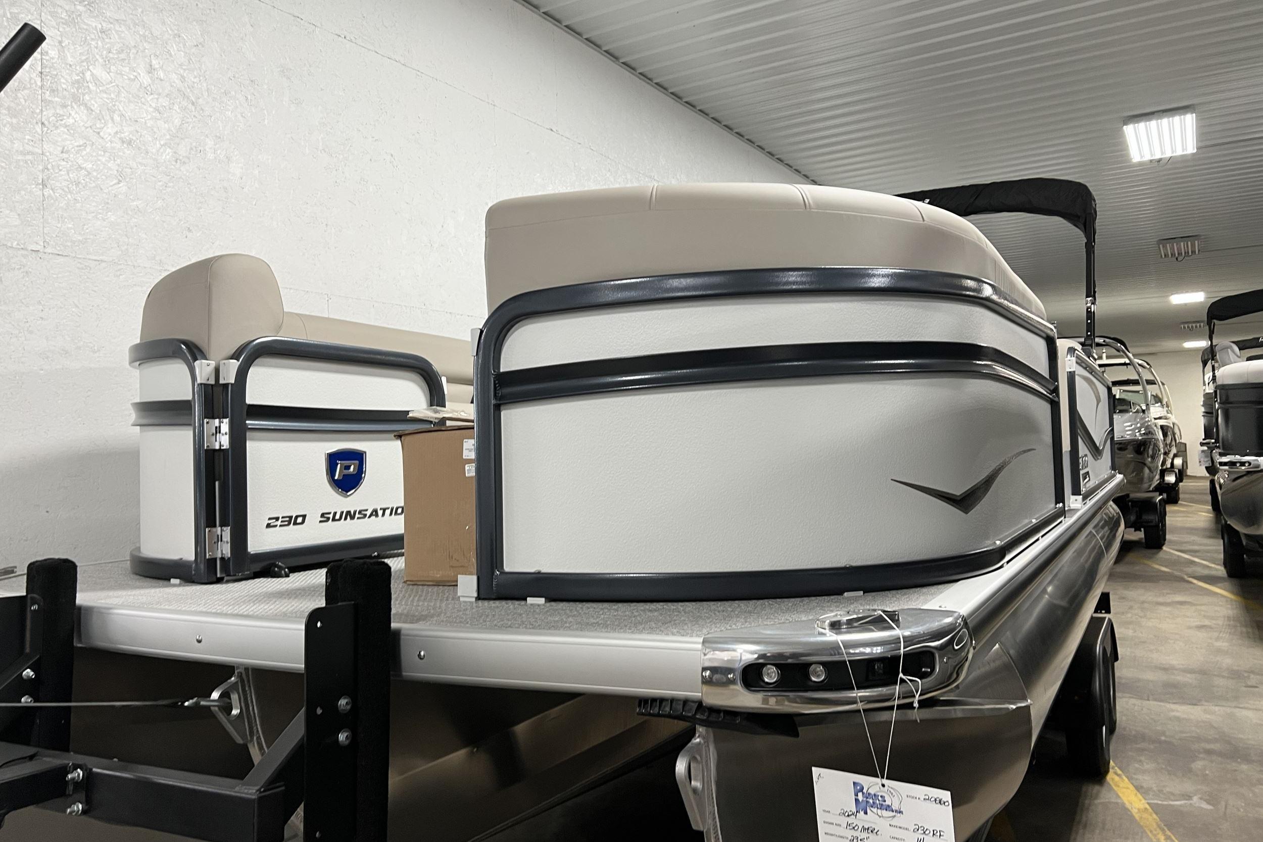 Premier Sunsation 230 RL 2023 Premier Sunsation 230 RL pontoon boat in indoor storage facility.