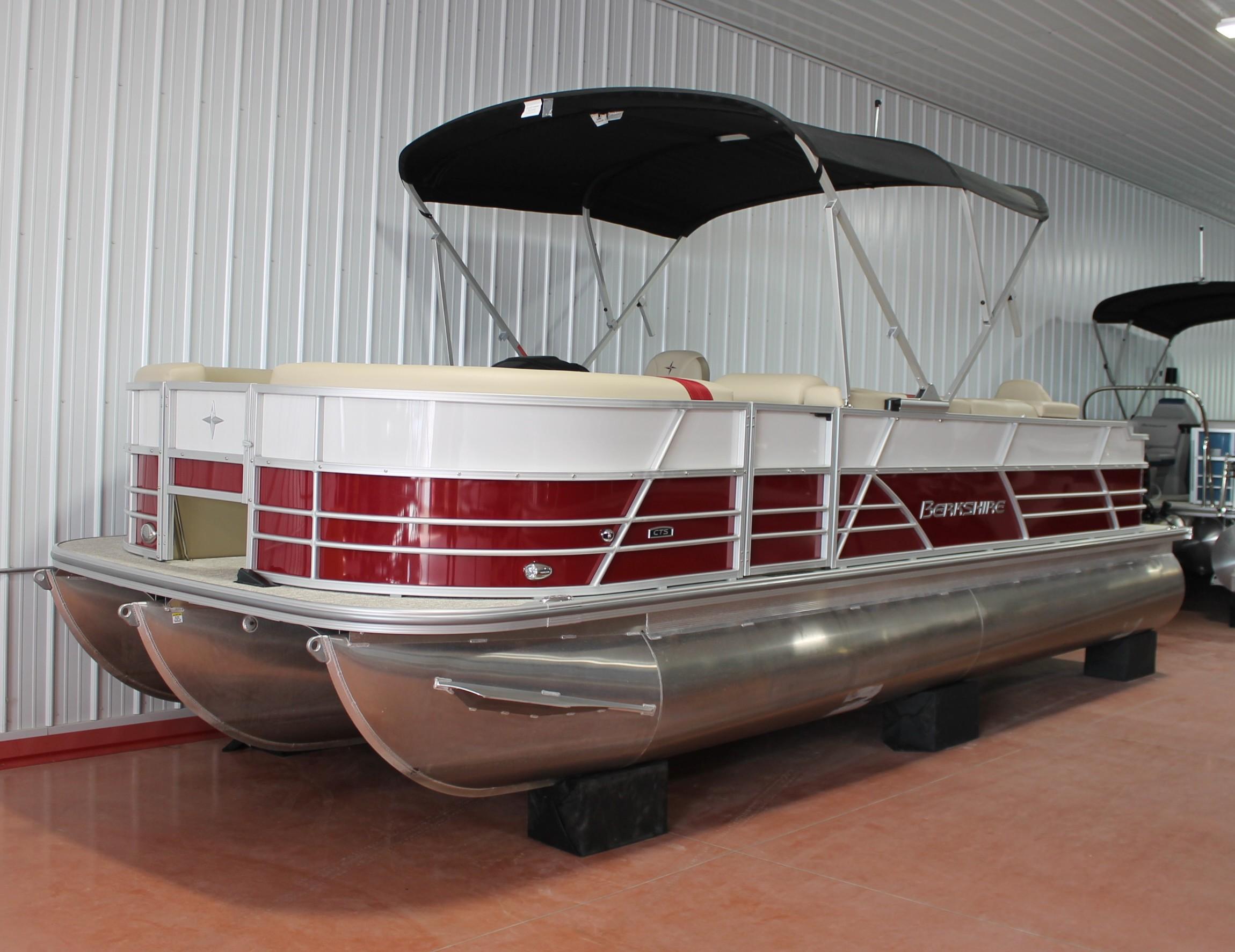 Berkshire 24 RFC CTS 2024 Berkshire 24 RFC CTS pontoon boat with red and white design in showroom.