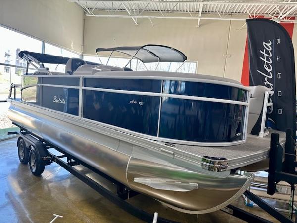 Barletta A22QC 2025 Barletta A22QC pontoon boat displayed indoors on a trailer.