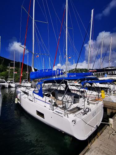 Beneteau Oceanis 46.1 2020 Beneteau Oceanis 46.1 sailboat docked in a marina under a clear blue sky.