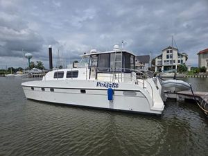Endeavour Trawler Cat 38 2006 Endeavour Catamaran Trawler Cat 38 docked in a marina under cloudy skies.