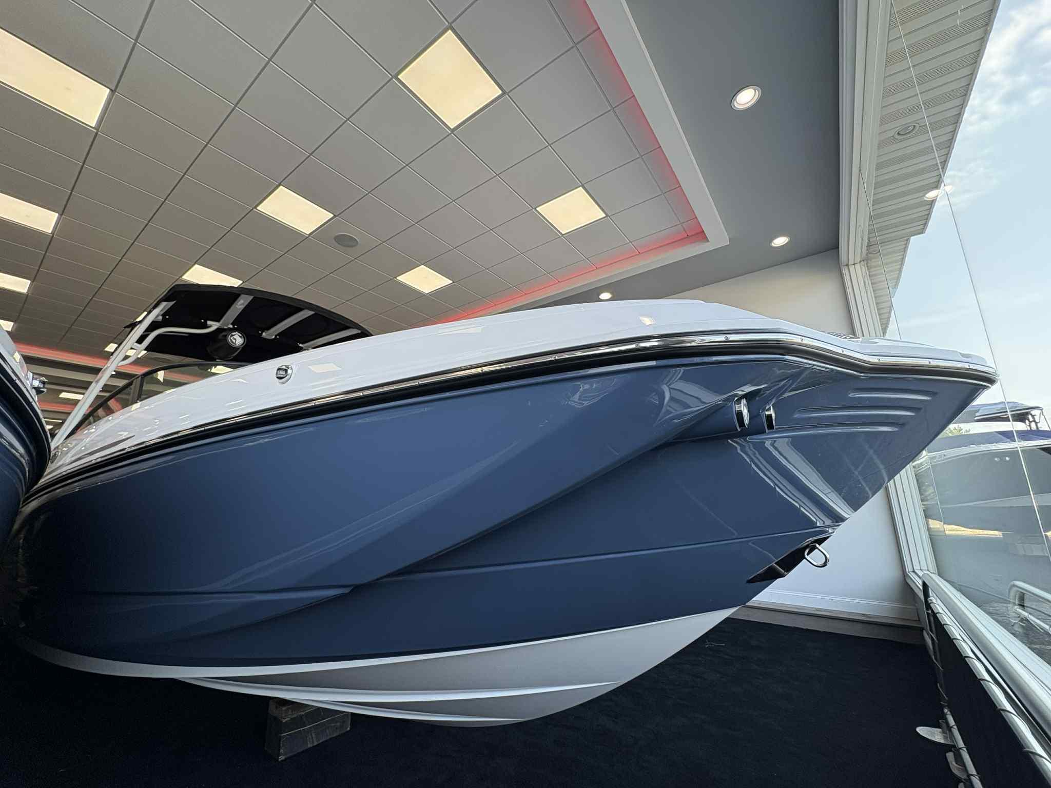 Monterey M45 2026 Monterey M45 boat displayed indoors, showcasing sleek blue and white design.