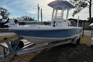 Robalo 226 Cayman 2023 Robalo 226 Cayman boat on trailer, featuring a sleek blue hull design.