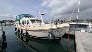 Linssen Grand Sturdy 380 AC 2008 Linssen Grand Sturdy 380 AC yacht docked at marina, featuring elegant design and green canopy.