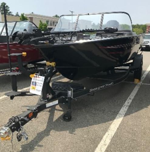 Ranger VX1888 WT 2023 Ranger VX1888 WT boat on a trailer in a parking lot.
