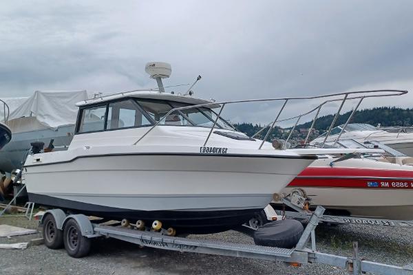 Bayliner 2059 Trophy Cuddy 1993 Bayliner 2059 Trophy Cuddy on trailer, parked outdoors.