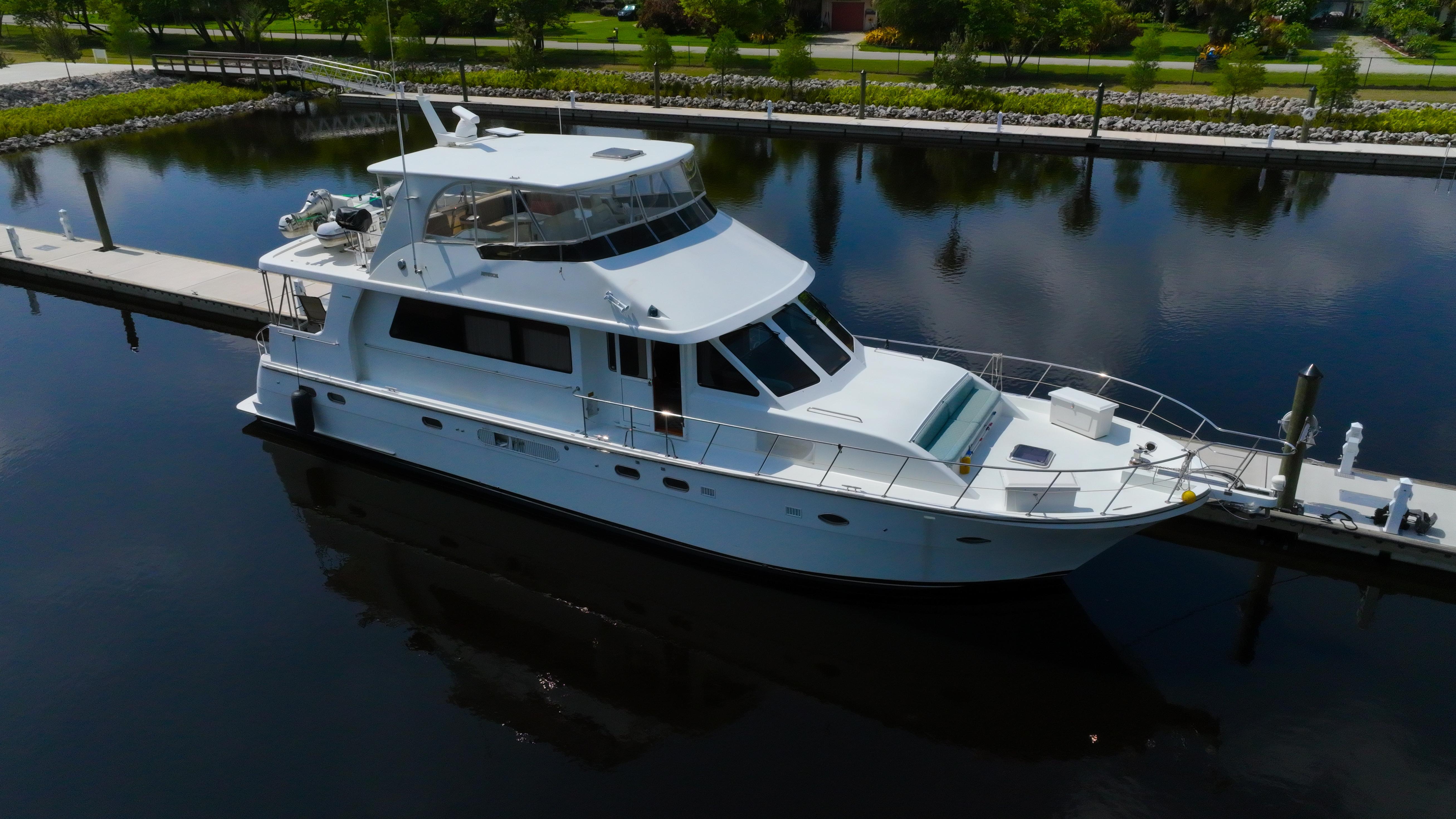 Jefferson Marquessa 60 MY Luxury 2005 Jefferson Marquessa 60 MY yacht docked in serene marina setting.