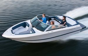 Four Winns H210 2013 Four Winns H210 speedboat cruising on water with passengers.