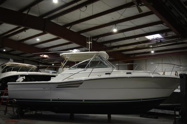 Pursuit 3400 Express 1999 Pursuit 3400 Express boat in indoor storage facility.