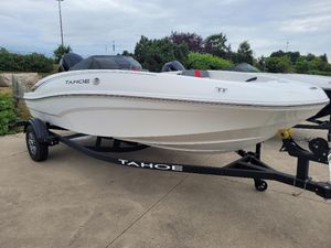 Tahoe T16 2025 Tahoe T16 boat on trailer, parked outdoors, showcasing sleek white design.