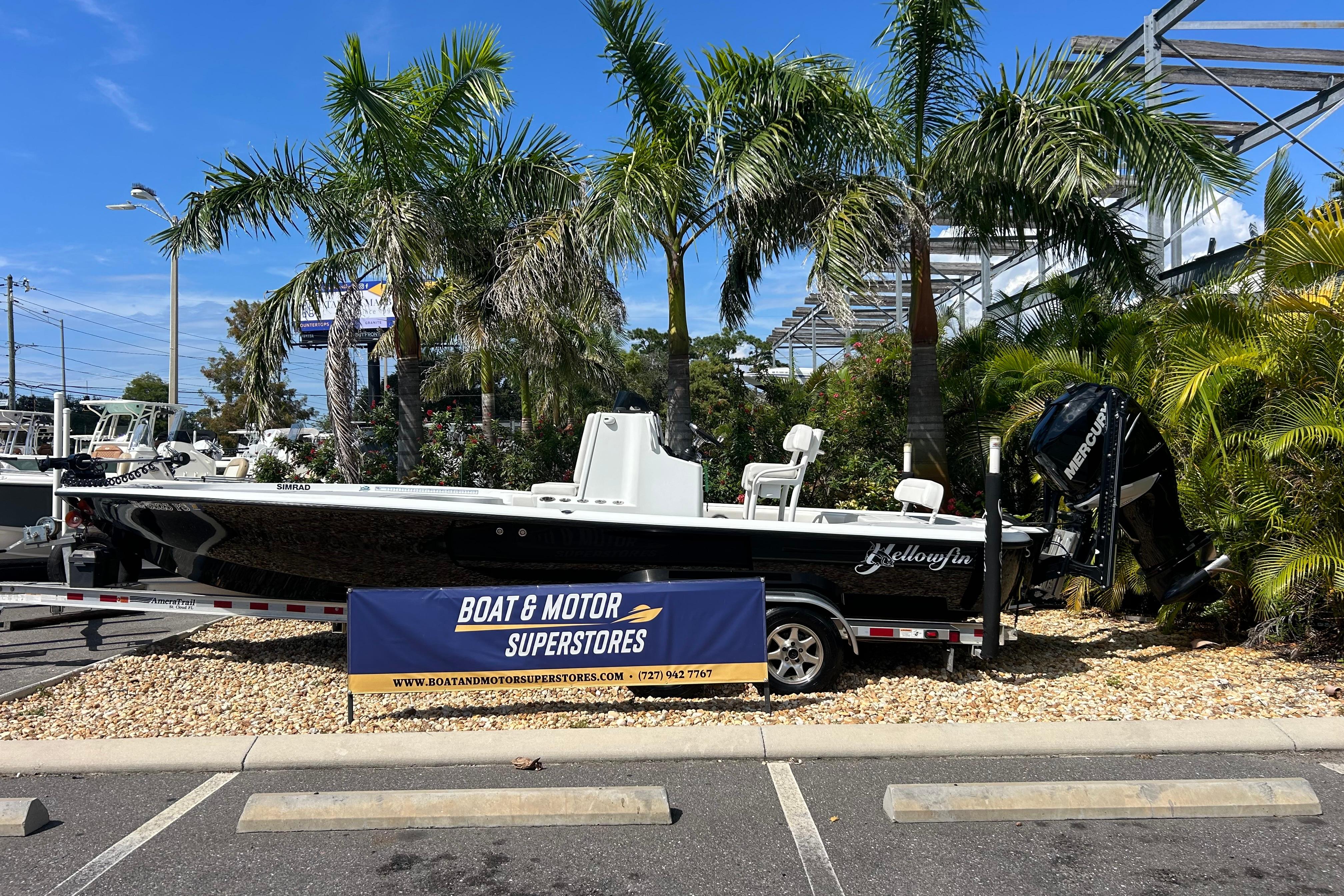 Yellowfin 24 Bay 2013 Yellowfin 24 Bay boat displayed at Boat & Motor Superstores, surrounded by palm trees.