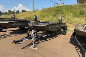 Excel 1751 Viper F4 2026 Excel 1751 Viper F4 boat on trailer, parked outdoors.