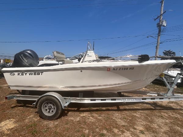 Key West 179FS 2022 Key West 179FS boat on trailer, side view, clear sky background.