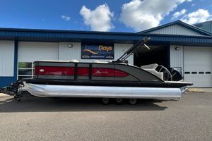 Barletta L23U 2020 Barletta L23U pontoon boat parked outside Lake Days Marine building.