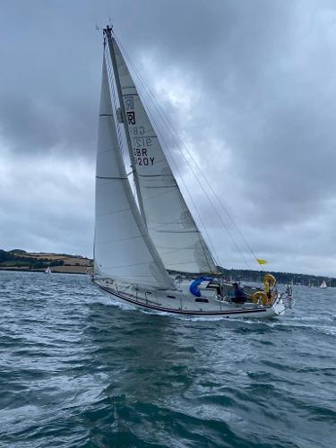 Rival 32 Sailing yacht Rival 32 from 1977 navigating choppy waters under cloudy skies.