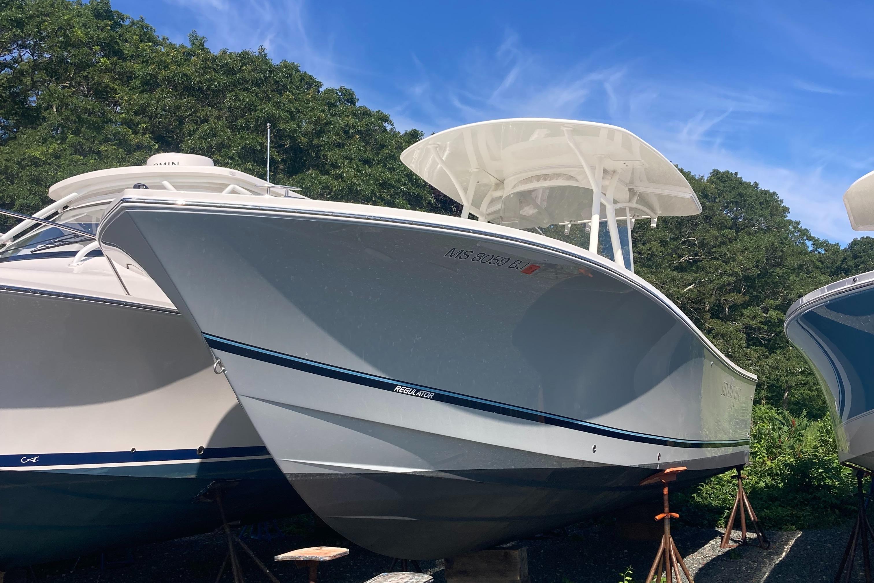 Regulator 28 Center Console w/ Optimus 360 Joystick Control 2018 Regulator 28 Center Console boat with Optimus 360 Joystick Control, docked outdoors.