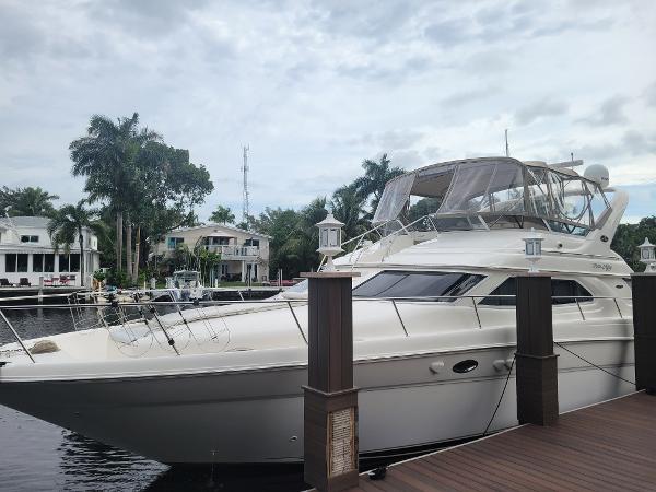 Sea Ray 450 Express Bridge 2001 Sea Ray 450 Express Bridge yacht docked by waterfront homes.