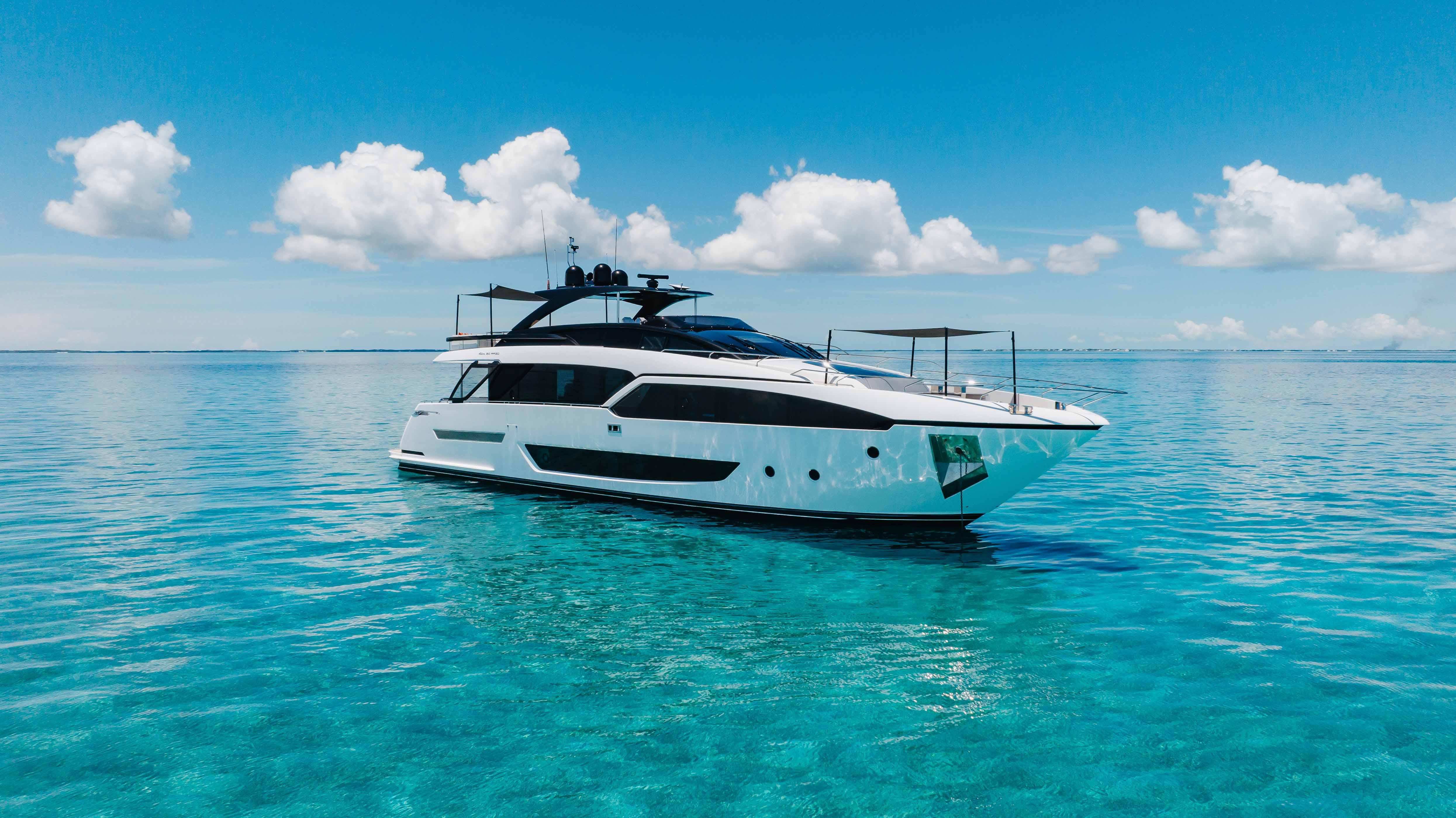 Riva 90 argo Luxury 2020 Riva 90 Argo yacht on clear blue ocean under a bright sky.